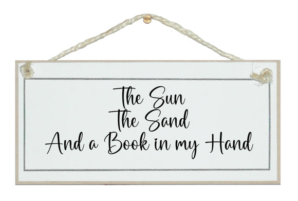 The sun, the sand & a book in my hand