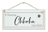 A.....dog breed, lives here signs