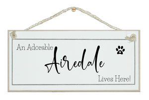 A.....dog breed, lives here signs