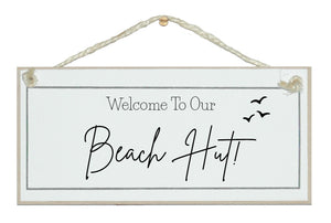 Welcome to our beach hut sign