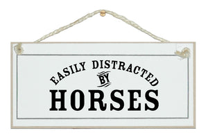 Easily distracted by horses sign
