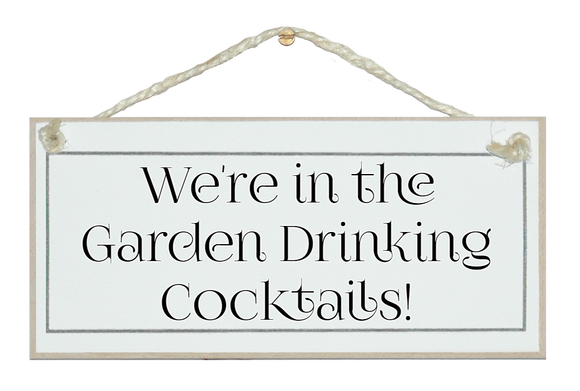 In the garden drinking Cocktails! sign
