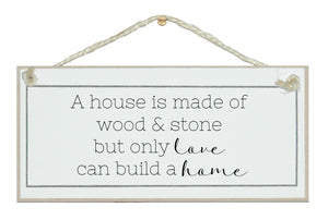 House, wood and stone, love a home. Sign.